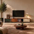 Amber wood extendable TV stand under wall-mounted TV in mid century living room