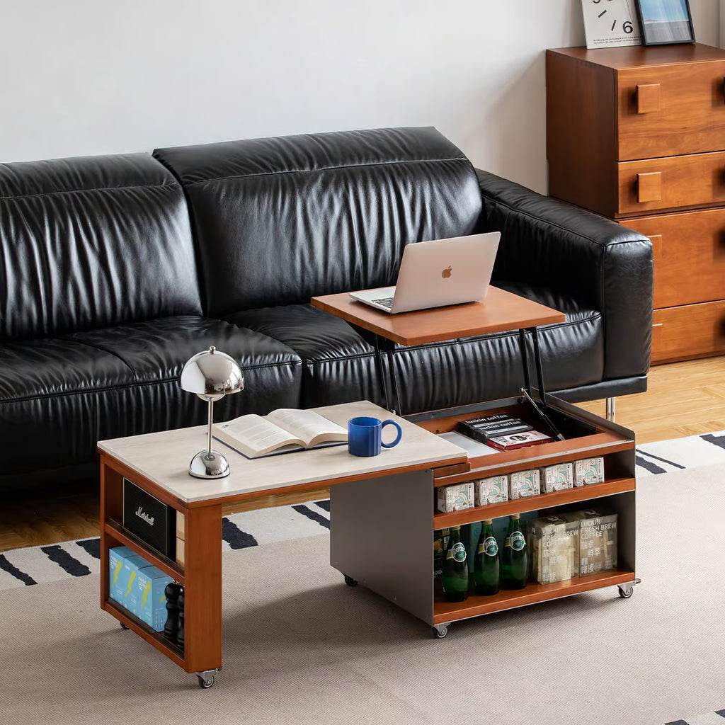 Lift top coffee table raised to laptop height with the side table pulled out along a leather sofa