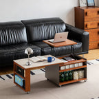 Lift top coffee table raised to laptop height with the side table pulled out along a leather sofa