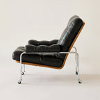 Mid century modern lounge chair on a stainless steel frame with casters