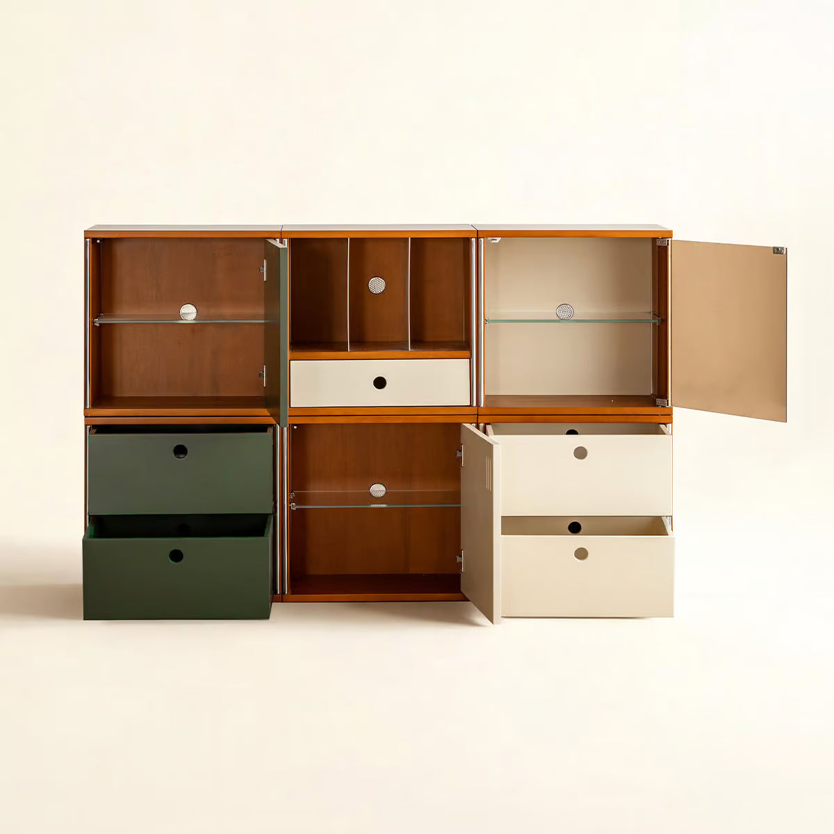 Six modular cabinet fronts shown open, with glass door, drawers and shelves in cream and green