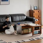 Woman reading on the floor beside a coffee table