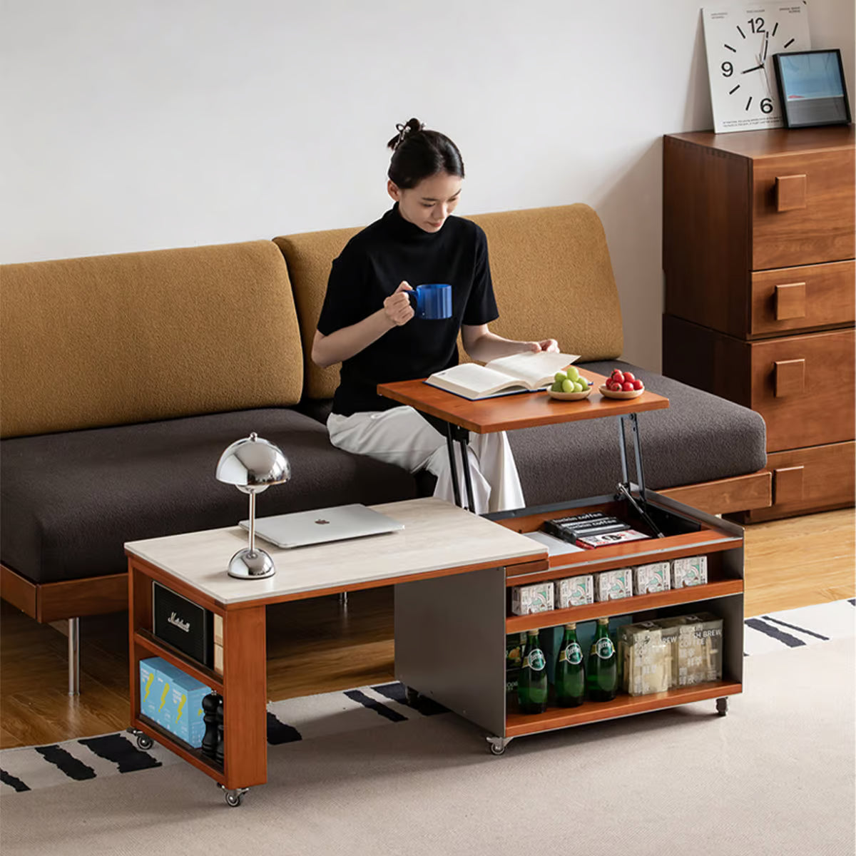 Woman working from the sofa at a lift top coffee table with the top raised in front of her